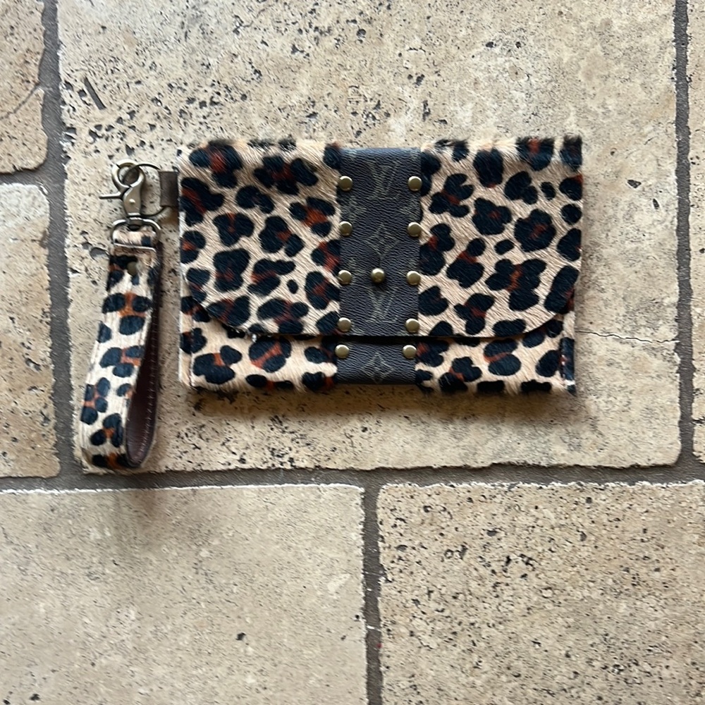 Leopard print clutch with LV logo